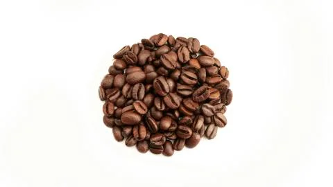 Coffee beans on a white background. The view from the top. Stock Photos