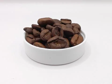 Coffee beans on white close up Stock Photos