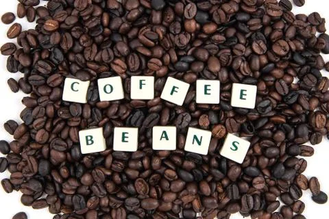 COFFEE BEANS white cube text on white background AND coffee beans background Stock Photos