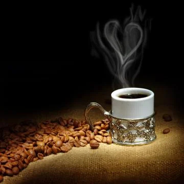 Coffee beans with white cup Stock Photos