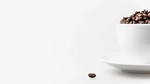 Coffee beans in white cup Stock Photos