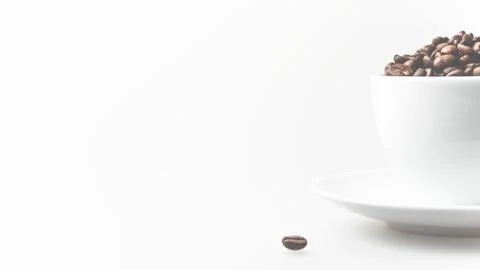 Coffee beans in white cup Stock Photos