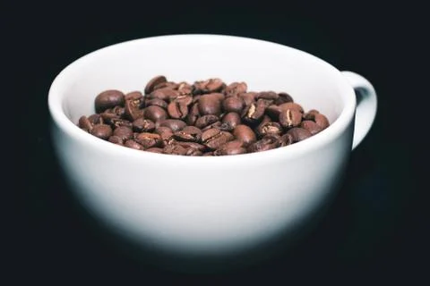 Coffee beans in white cup Stock Photos