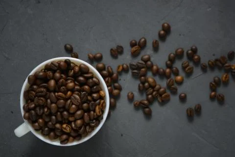 Coffee beans in a white Cup Stock Photos