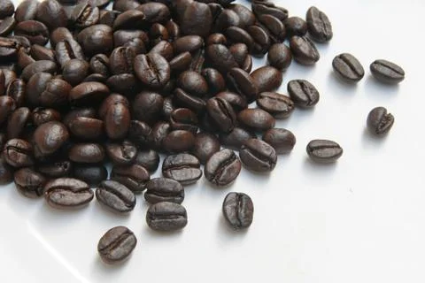 Coffee beans on white floor Stock Photos