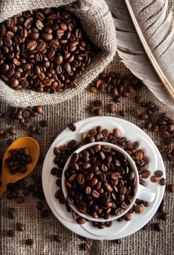 Coffee beans in white mug Stock Photos