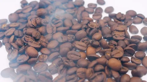 Coffee Beans On White Paper Close Up And White Smoke Slow Mo Stock Footage 303997793