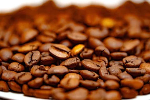 Coffee beans on a white plate. dark background Fotos Stock