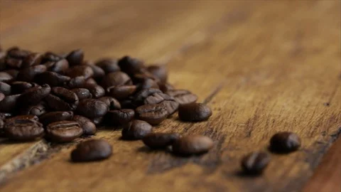 Coffee Beans on Wooden Table Closeup Track Shot Stock Footage 99163362