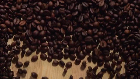 Coffee beans on a wooden table. Video stock 71337886