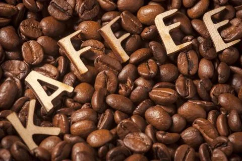Coffee beans with word Full format view of roasted coffee beans with woode... Stock Photos