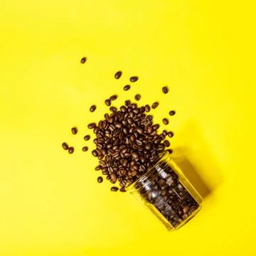 Coffee beans on yellow background, flat lay, top view 写真素材