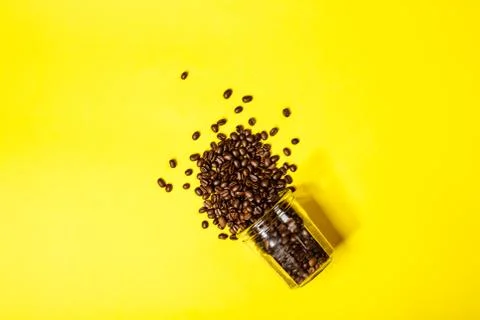 Coffee beans on yellow background Stock Photos