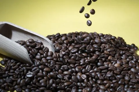 Coffee beans on a yellow background Stock Photos