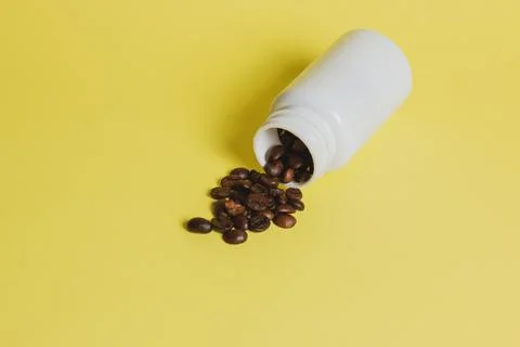 Coffee beans on yellow background Stock Photos
