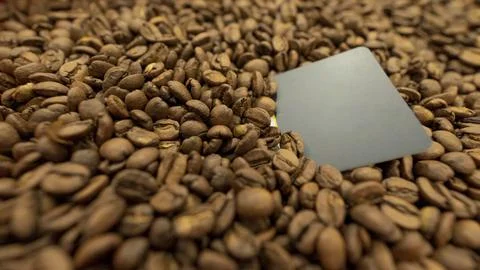 Coffee beans with yellow post it to put your logo or message Stock Photos