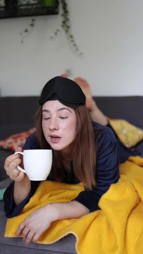 Coffee in bed becomes her favorite morning ritual Stock-Footage 340087043