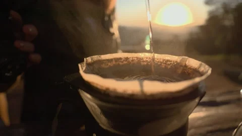 Coffee being brewed in a beautiful sunset Stock Footage 258600479