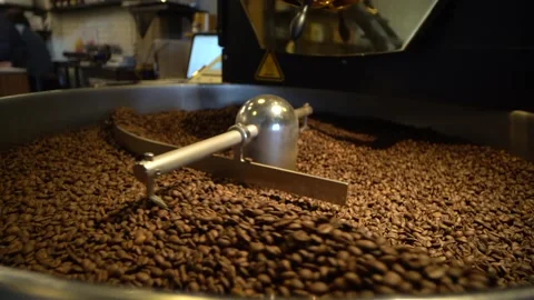 Coffee Being Mixed In A Coffee Roasting Machine. Mixing Coffee. Stock Footage 196187553