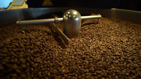Coffee Being Mixed In A Coffee Roasting Machine. Mixing Coffee. Video stock 196187587