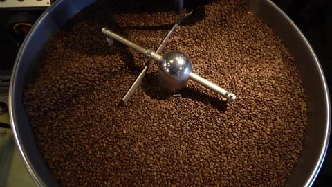 Coffee Being Mixed In A Coffee Roasting Machine. Mixing Coffee. Video stock 196187913