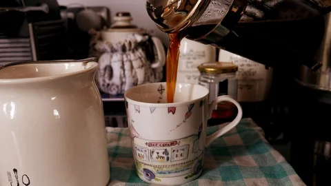 Coffee being poured into cup 스톡 동영상 107000115