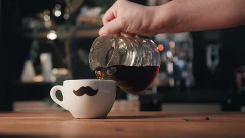 Coffee is being poured into mug Stock Footage 132720246