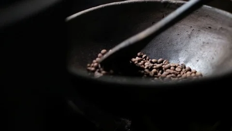 Coffee being roasted by hand in a coffee plantation, Bali, Indonesia Stock Footage 93339316