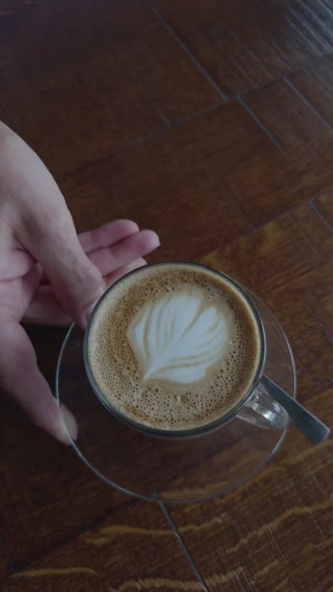 Coffee being slid across table Stock Footage 286223365