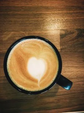 Coffee in black cup Stock Photos