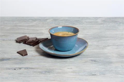 Coffee in a blue cup - grey background Stock Photos