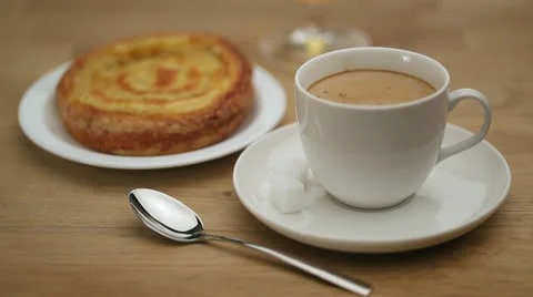 Coffee with brandy and a bun Stock Footage 22899574