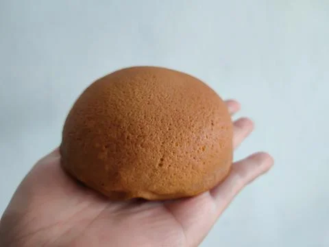 Coffee bread on the hand Stock Photos