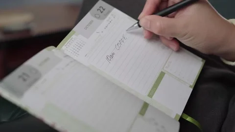 Coffee Break and Lunch Time Blocked Out in Paper Day Planner Stock Footage 343974491