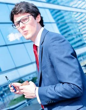 Coffee break with an electronic cigarette Stock Photos