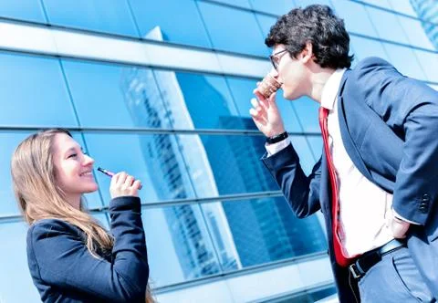 Coffee break with an electronic cigarette Stock Photos