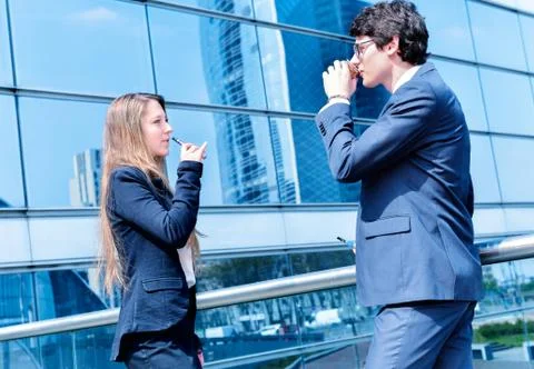 Coffee break with an electronic cigarette Stock Photos