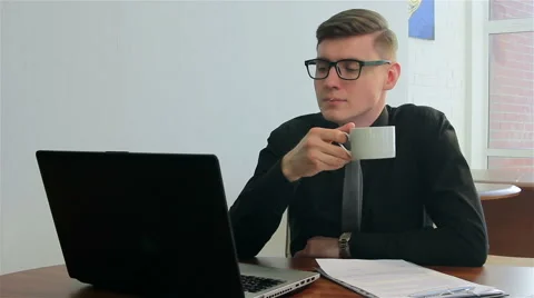 Coffee break in front of a laptop Stock Footage 51167405