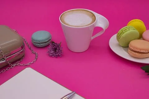 Coffee Break with Macarons on a Pink Background Stock Photos