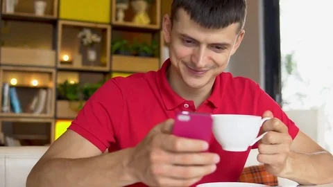 Coffee break. Man using app on his mobile phone. Stock Footage 84497339
