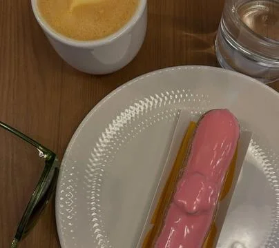 Coffee Break with Pink Glazed Éclair, Espresso, and Green Sunglasses Stock Photos