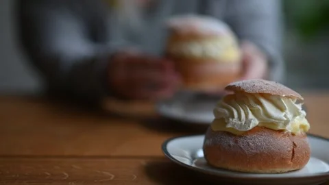 Coffee break with semlor - fresh traditional pastry in Sweden Stock Footage 259045334