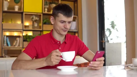 Coffee break with smartphone Stock Footage 84464427