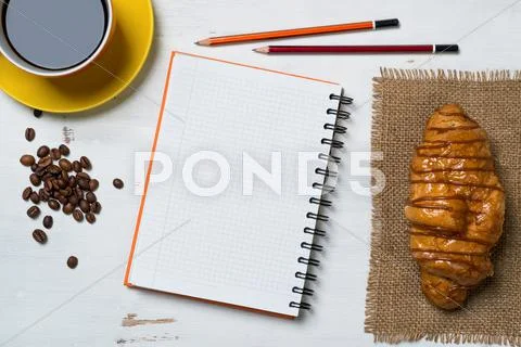 Coffee break with snack Stock Photos