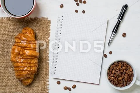 Coffee break with snack Stock Photos