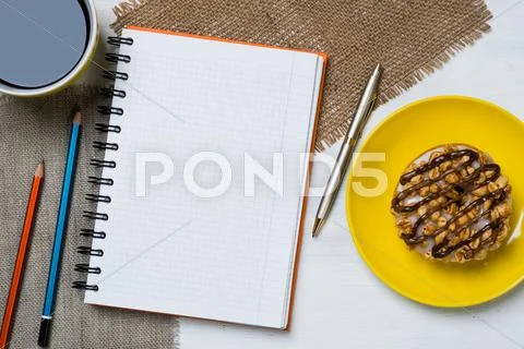 Coffee break with snack Stock Photos