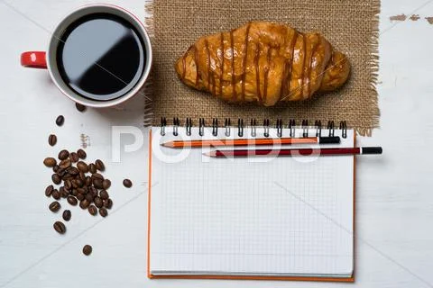 Coffee break with snack Stock Photos