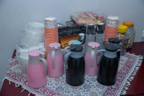Coffee break table setting with thermal flasks, paper cups, candies, The table Stock Photos