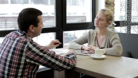 Coffee break of two employees at lunchtime in a restaurant Stock Footage 155728334