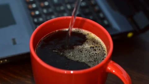 Coffee is brewed in a cup, water is poured into a red cup. Stock Footage 151311341
